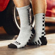 Hoonigan NEVER LIFT socks featuring a bold logo design and vibrant colors.