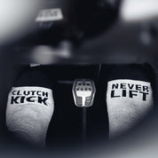 Hoonigan NEVER LIFT Socks featuring a bold design with the Hoonigan logo in white against a black background.