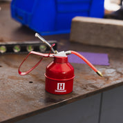 Hoonigan oil can featuring a bold black and white design with Hoonigan logo and racing graphics.