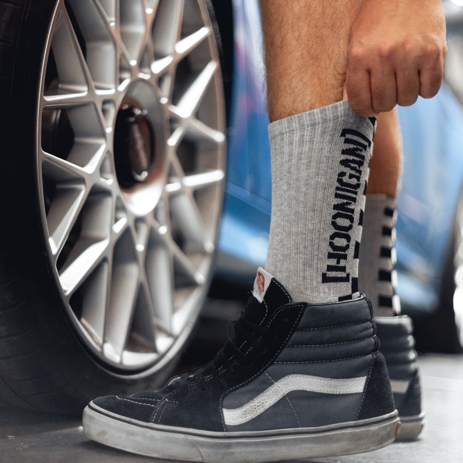 Hoonigan NEVER LIFT socks featuring bold graphics and a comfortable design in black and white.