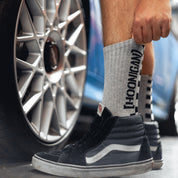 Hoonigan NEVER LIFT socks featuring bold graphics and a comfortable design in black and white.