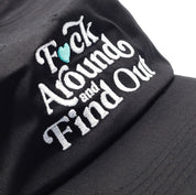 Hoonigan FIND OUT Unstructured Strapback Hat featuring a black design with embroidered logo on the front.