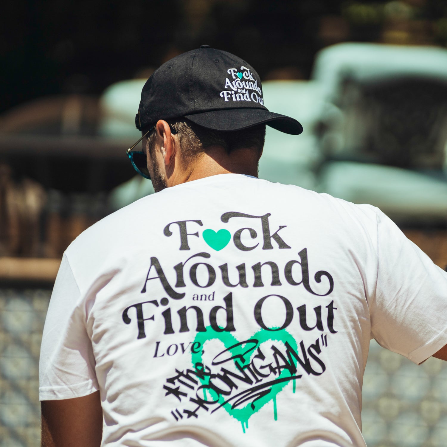 Hoonigan FIND OUT 2.0 Short Sleeve Tee featuring bold graphic print on a black background.