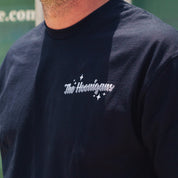 Close-up of a black Hoonigan FIND OUT V2 short sleeve tee with white logo and star graphics on the chest.