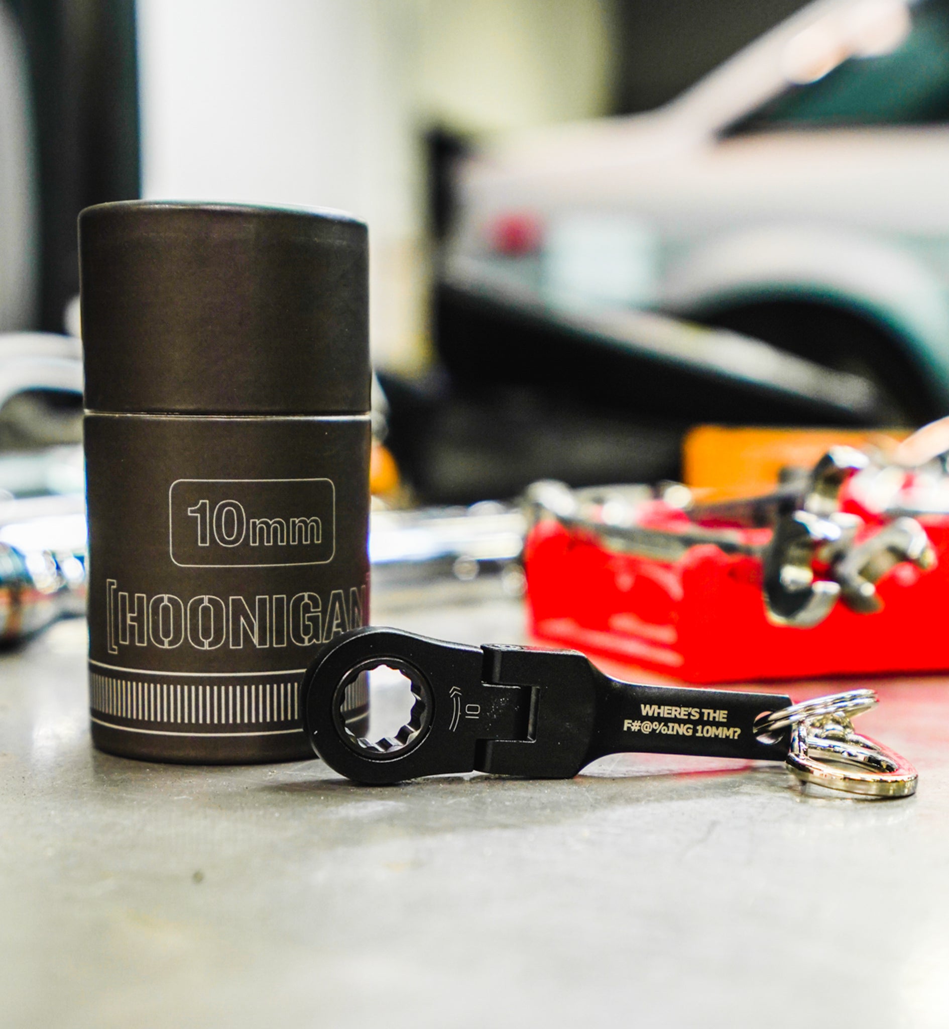Hoonigan FOUND IT Keychain featuring a 10mm socket design, perfect for automotive enthusiasts and mechanics.