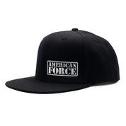 American Force LOGO Snapback Hat in black and white, featuring an embroidered logo on the front panel.