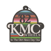 KMC NATIVES Air Freshener in a sleek bottle with a minimalist design, featuring a green and white color scheme and a decorative label.