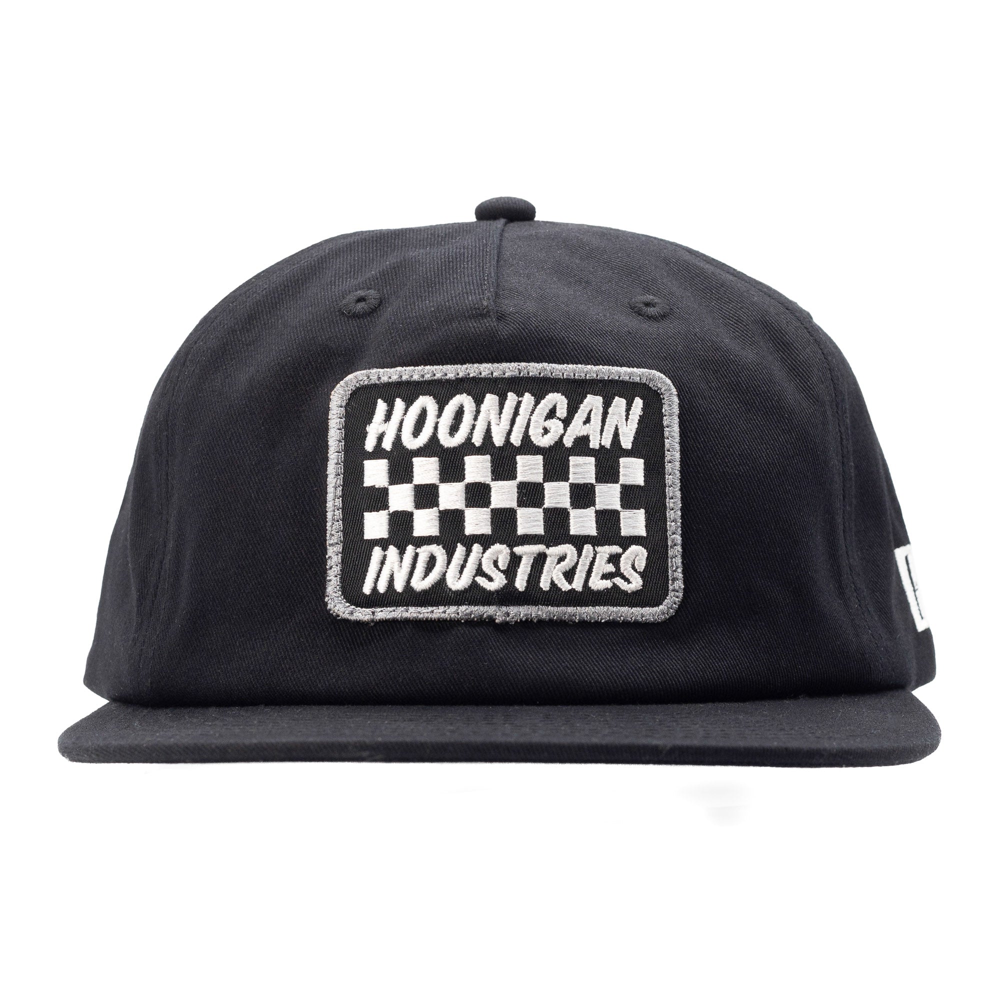Black unstructured snapback hat featuring a checkerboard patch with "Hoonigan Industries" embroidered on the front.