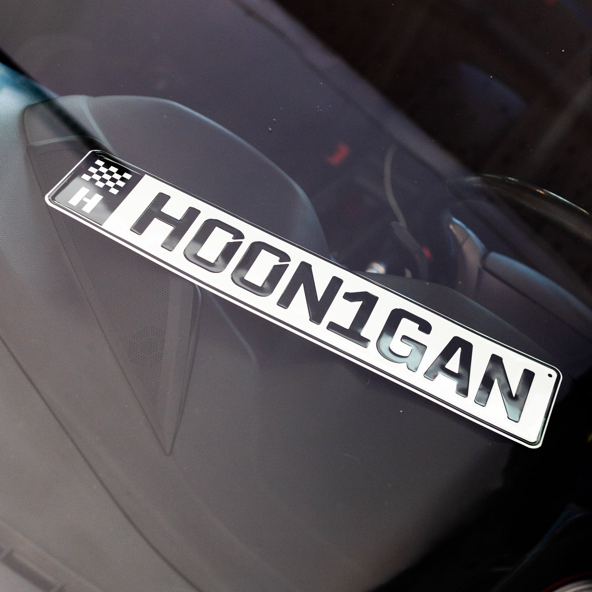 Hoonigan EURO license plate featuring the text HOON1GAN, designed for automotive enthusiasts and car culture fans.