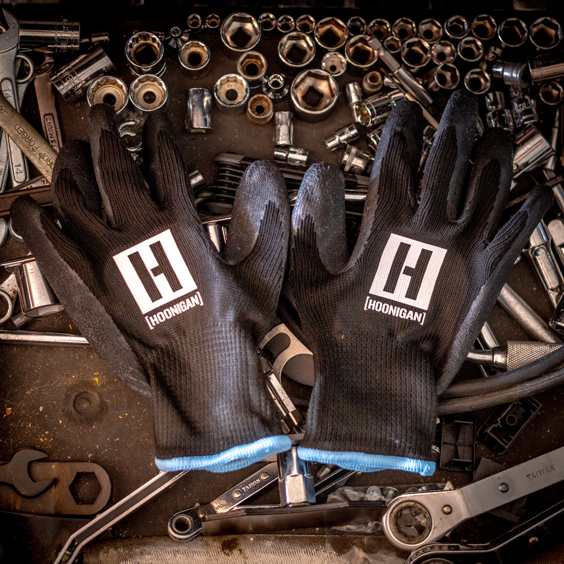 Hoonigan HBOX work gloves featuring a durable design, reinforced palms, and a black and neon green color scheme.