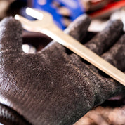Hoonigan HBOX work gloves with black and orange design, featuring reinforced fingertips and adjustable wrist straps.