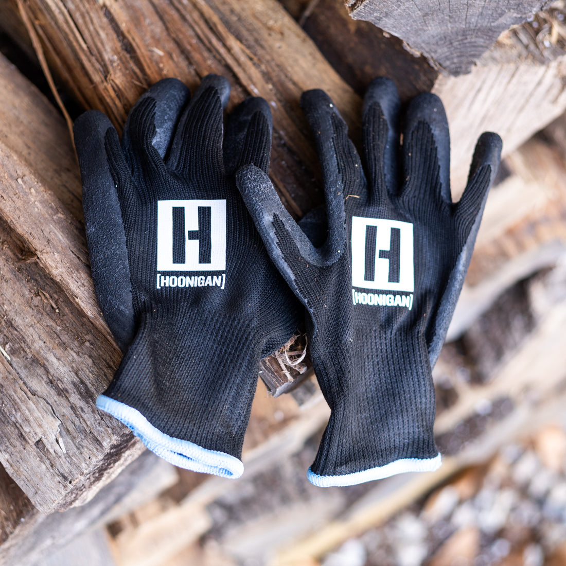 Hoonigan HBOX work gloves featuring a durable design, padded palms, and adjustable wrist straps, ideal for automotive work and heavy-duty tasks.