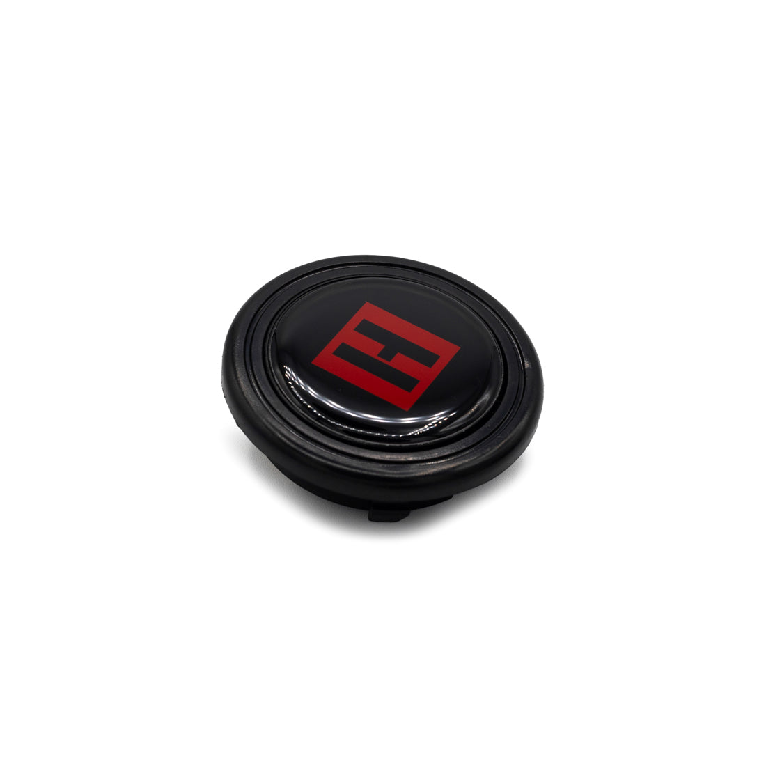Hoonigan H BOX HORN button featuring a circular black design with a prominent white H logo in the center, set against a grey background.