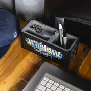 Hoonigan X Spen1 mini shipping container in vibrant colors, showcasing graffiti-style artwork and intricate designs.