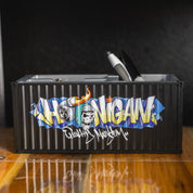 Alt text: Hoonigan X Spen1 branded mini shipping container in teal color with detailed graphics and a matte finish.