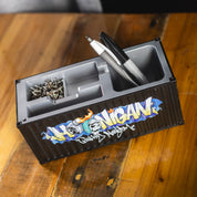 Hoonigan X Spen1 mini shipping container in vibrant colors with artistic graffiti designs.