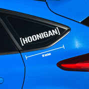 Hoonigan small die cut censor bar bracket logo sticker, 10 inches in black and white on a plain background.