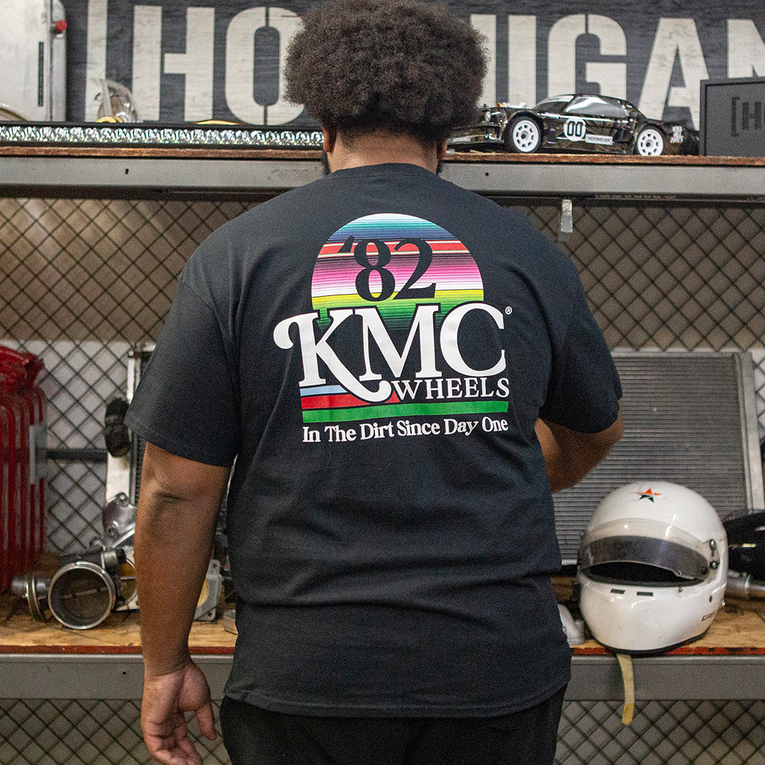 KMC DAY ONE Short Sleeve Tee displayed from the back, featuring a stylish black design suitable for casual wear.