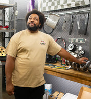 KMC DAY ONE Short Sleeve Tee in heather gray, featuring a relaxed fit and casual style, displayed on a model in a lifestyle setting.