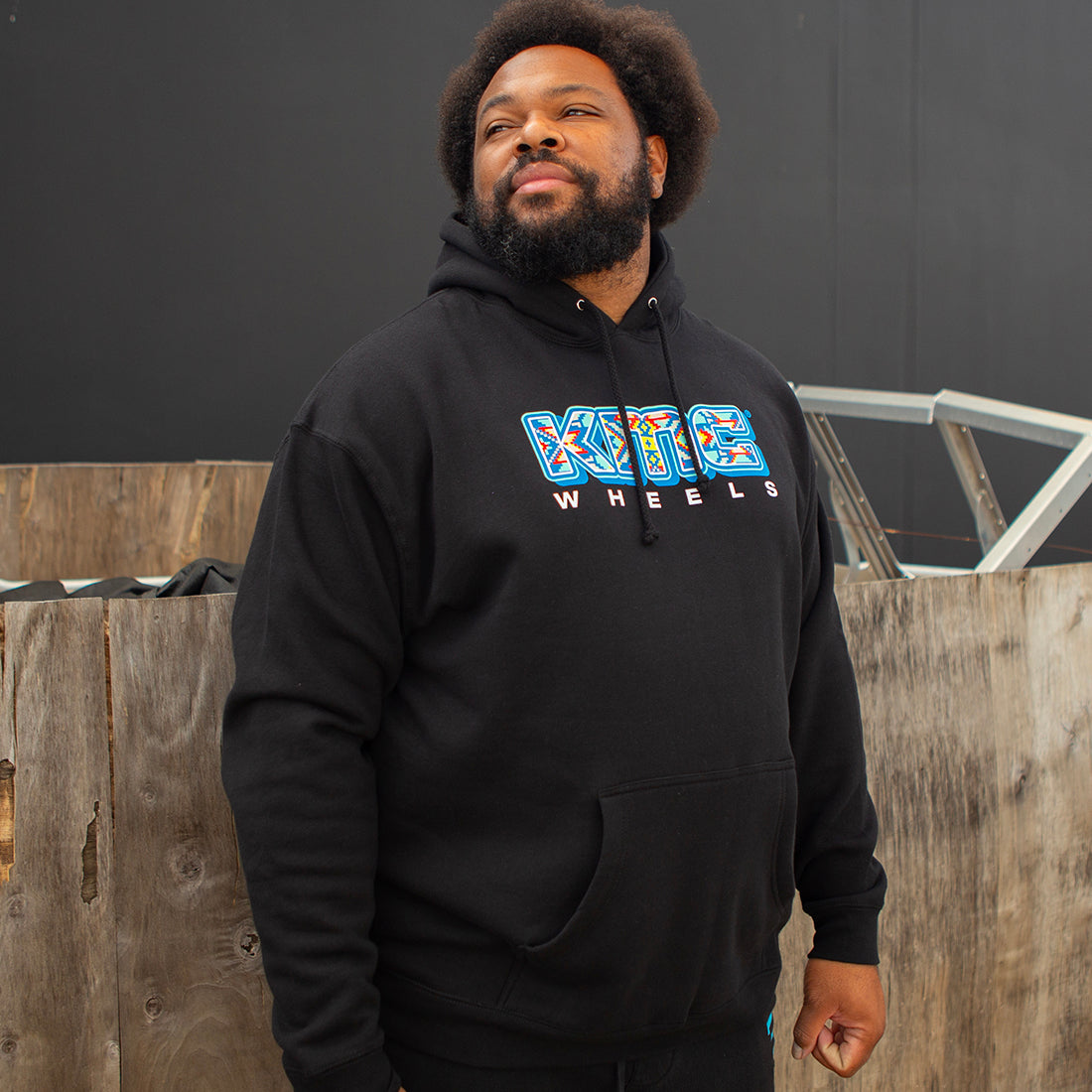 KMC NATIVES Hoodie in gray, featuring a front pocket and a stylish pullover design.