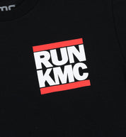 Black KMC RUN Short Sleeve Tee displayed on a hanger, featuring a minimalist design with reflective detailing.
