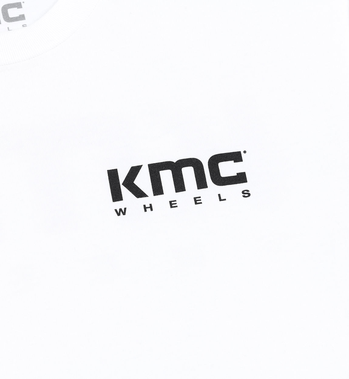 KMC Logo Short Sleeve Tee featuring a bold KMC logo on a black fabric background.