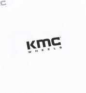 KMC Logo Short Sleeve Tee featuring a bold KMC logo on a black fabric background.