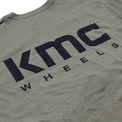 KMC Logo Short Sleeve Tee in navy blue, featuring a prominent white KMC logo on the front.