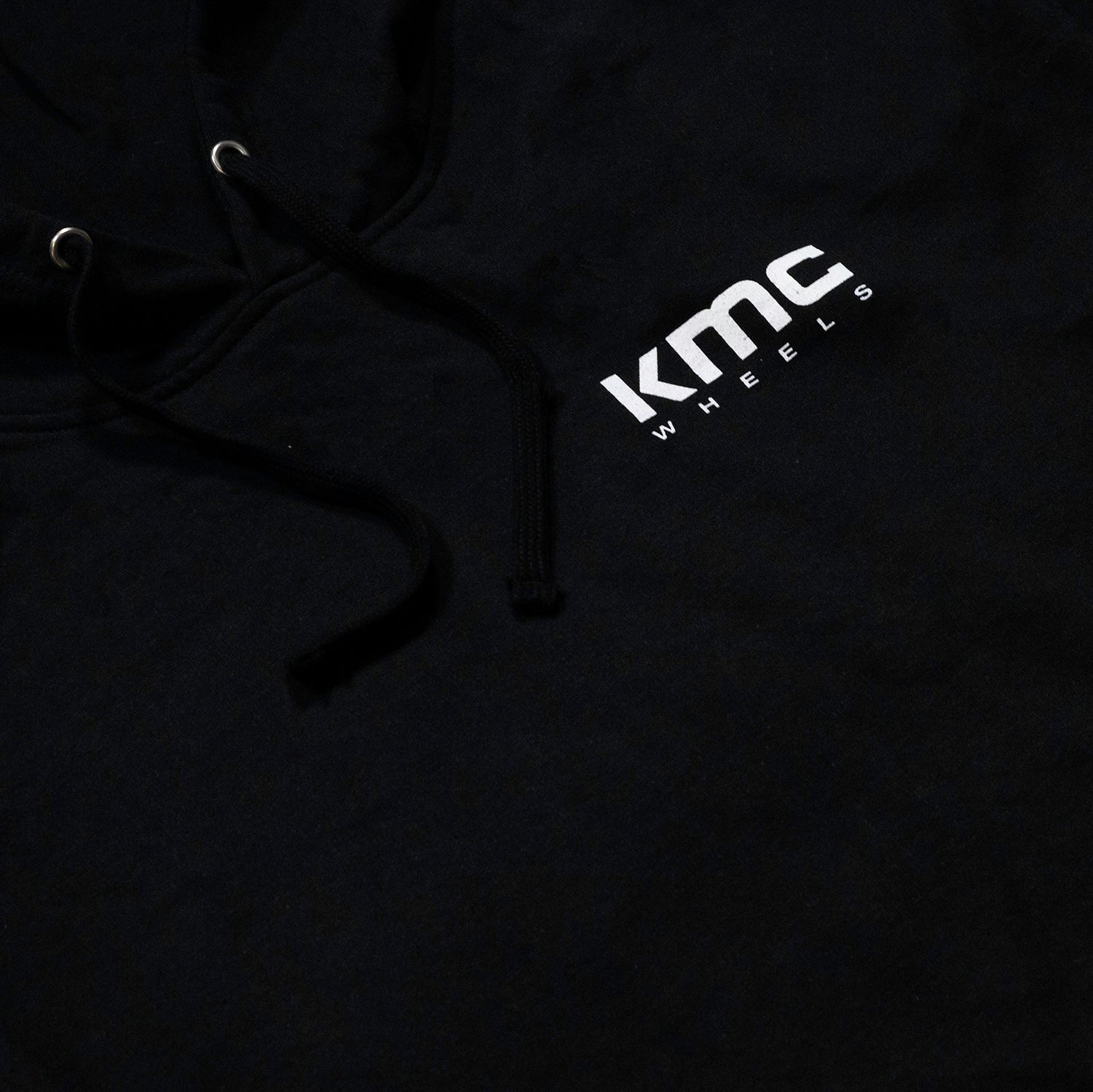 KMC Wheels logo hoodie in black, featuring a large white KMC logo on the front.