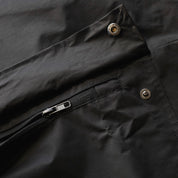 KMC Wheels V2 Half Zip Anorak Jacket in black with a large logo on the chest, featuring a half zipper and adjustable hood.