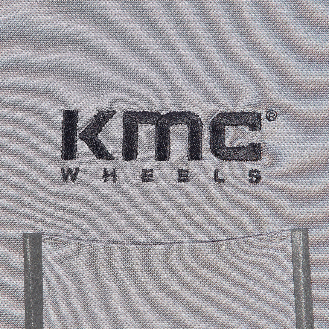 KMC Wheel grey short sleeve polo shirt with embroidered logo on the chest.