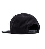 Moto Metal black snapback hat featuring a bold logo, shown from a back angled view.