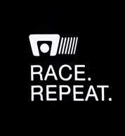 Motegi RACE REPEAT Short Sleeve Tee in black, showcasing front detail with racing-themed graphics.