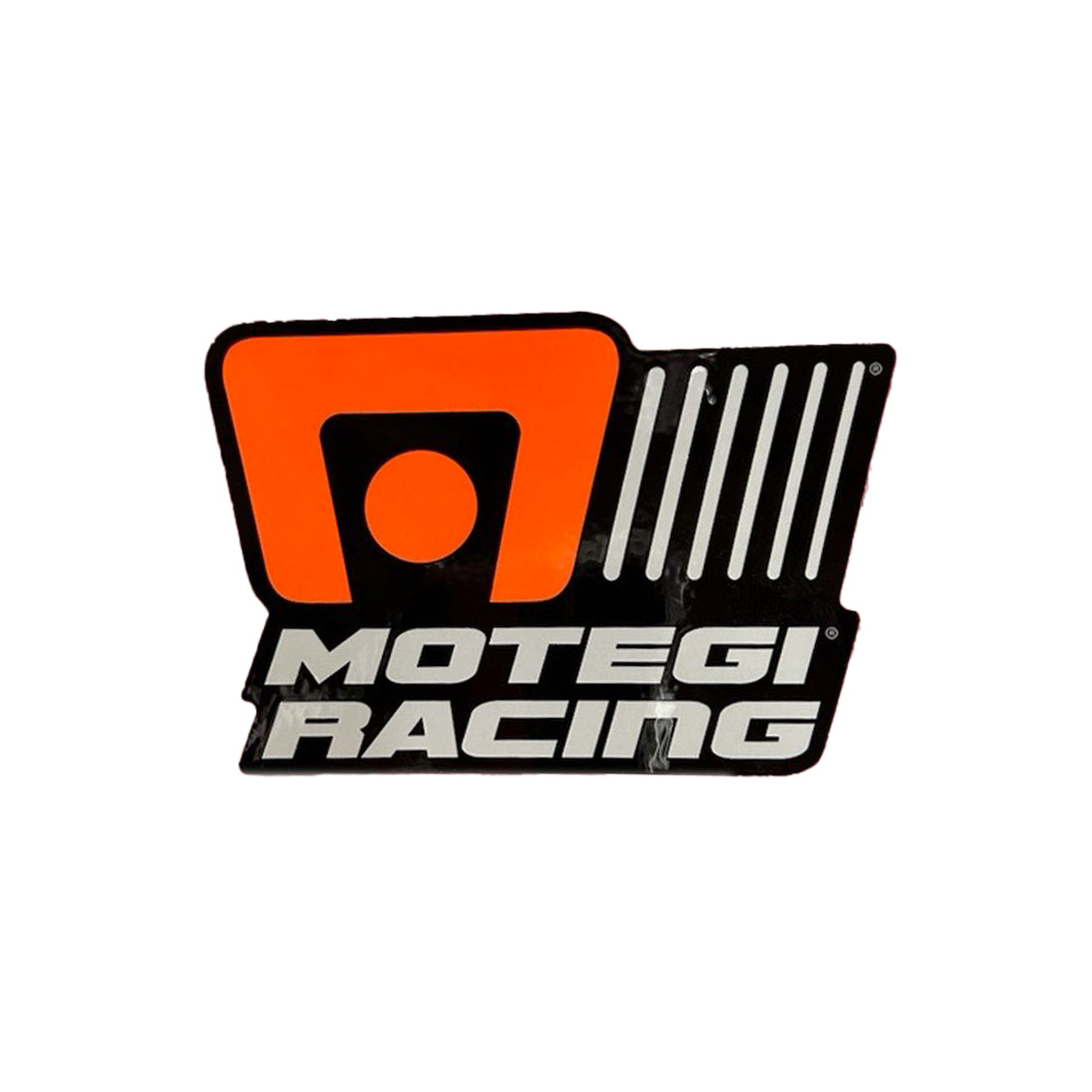 Motegi Racing sticker on a white background, featuring a bold red and black design with the brand logo and racing elements.