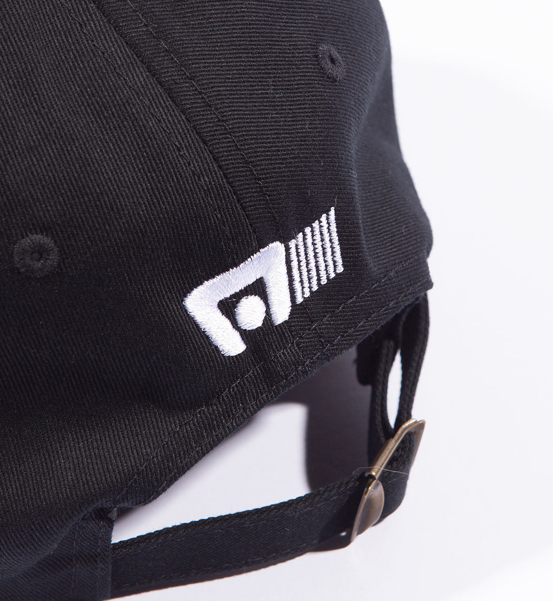 Motegi logo unstructured snapback cap in black with back detail showing adjustable strap.