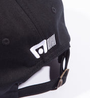 Motegi logo unstructured snapback cap in black with back detail showing adjustable strap.