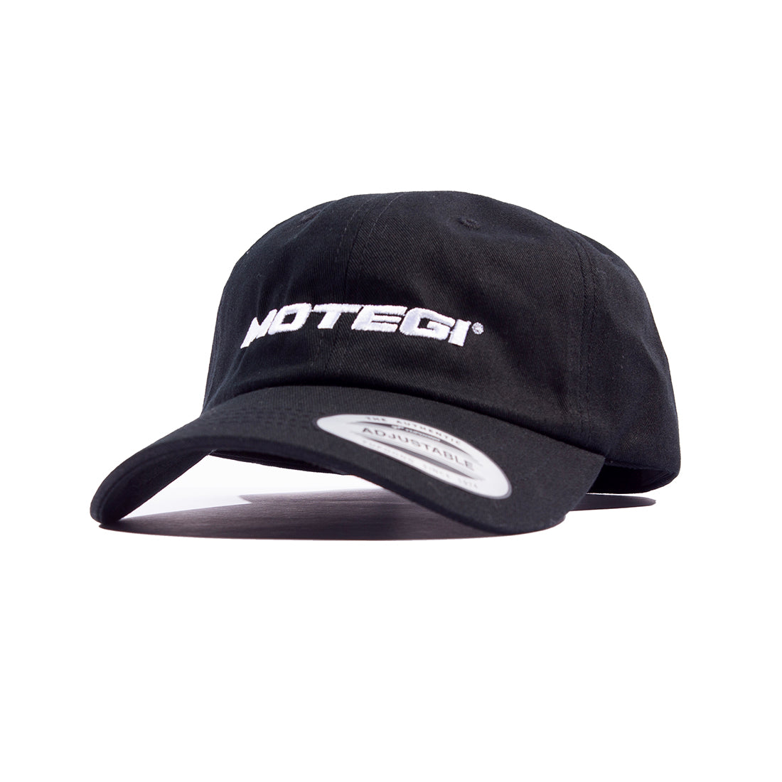 Black unstructured snapback cap featuring the Motegi logo on the front, showcased in an angled view.