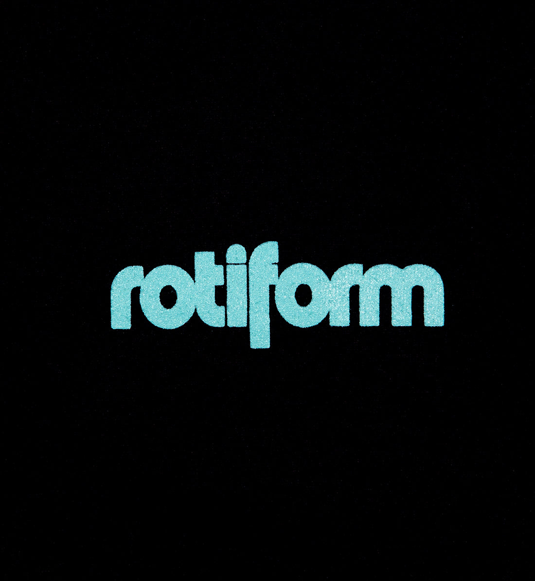 Rotiform STAPLE Short Sleeve Tee in black with teal logo detail on the front.