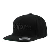 Rotiform STAPLE Snapback Hat in black with a flat brim and embroidered logo on the front.