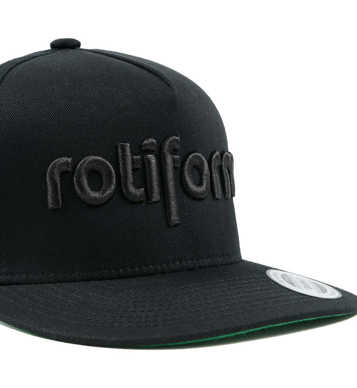 Rotiform STAPLE Snapback Hat in black with embroidered logo detail on the front.