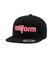 Rotiform STAPLE Snapback Hat in black and red, featuring a classic flat brim and embroidered logo on the front.