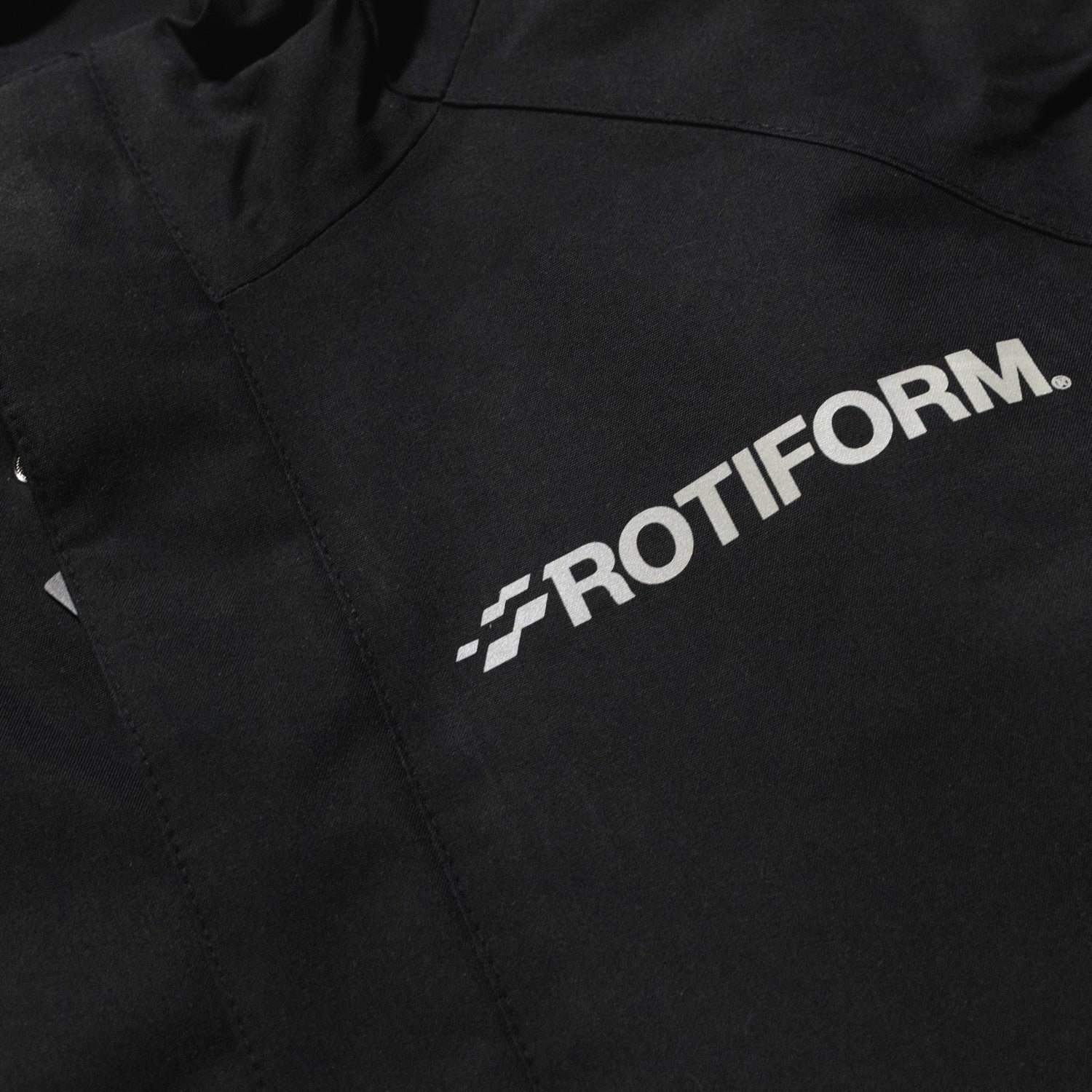 Rotiform Motorsports DIV Reflective Jacket featuring a sleek design with a reflective finish, ideal for visibility and style.