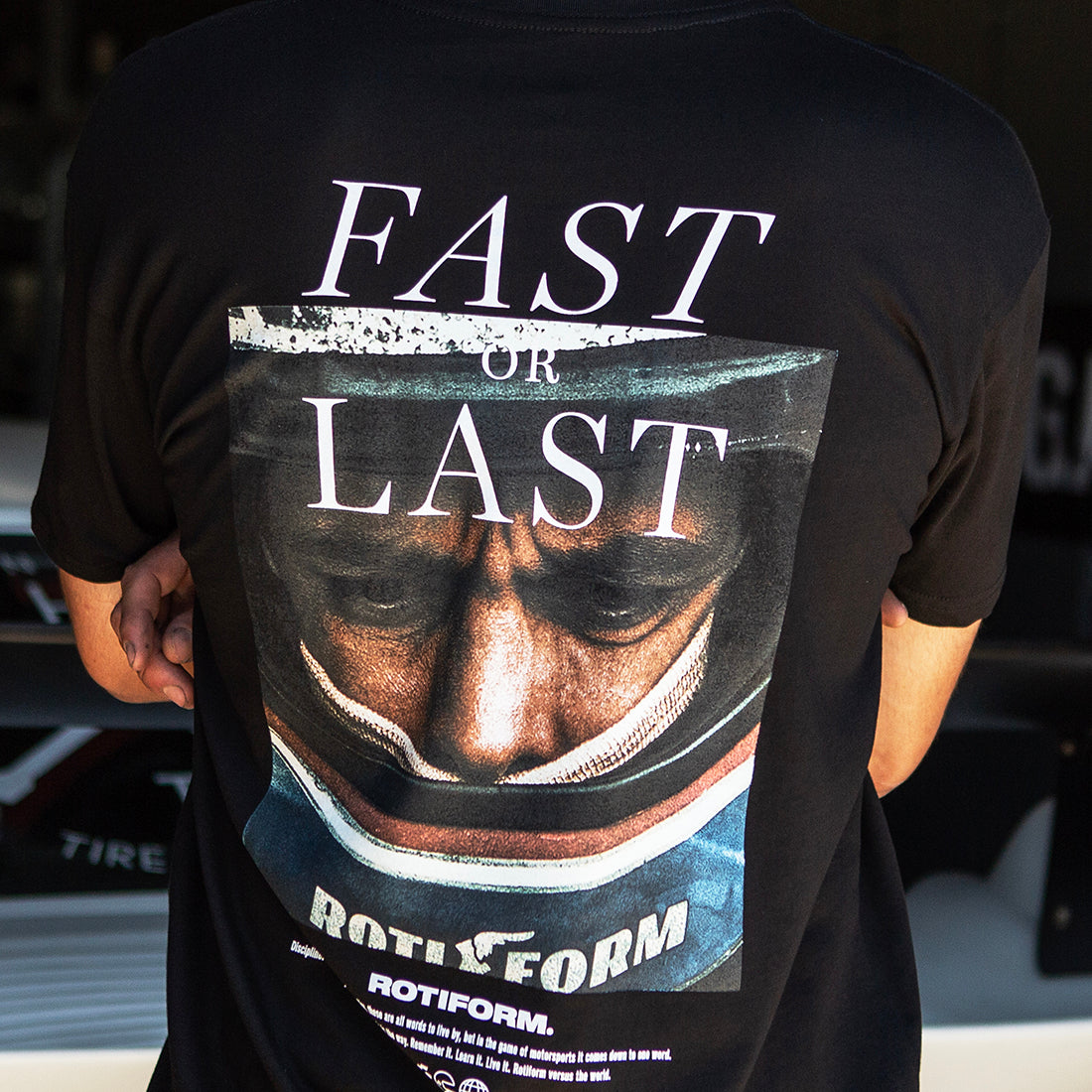 Back view of the Rotiform FAST OR LAST Short Sleeve Tee in black, featuring a bold graphic design.