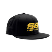 Smittybilt black snapback hat with white logo, featuring a flat brim and adjustable strap.