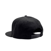 Smittybilt Snapback Hat in black featuring a white logo on the front and adjustable snapback closure.