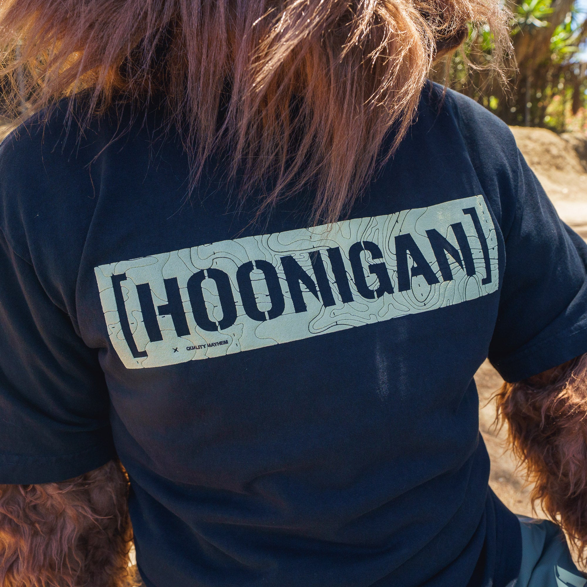 Black T-shirt with a large "HOONIGAN" graphic and topographic map design on the front.