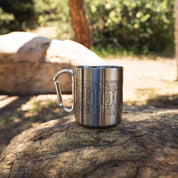 Stainless steel Carabiner Mug with topographic design and Hoonigan branding, ideal for outdoor adventures and camping.