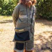 Hoonigan H.A.V.O.C. rain-activated windbreaker jacket worn outdoors, featuring multiple pockets and a rugged design.