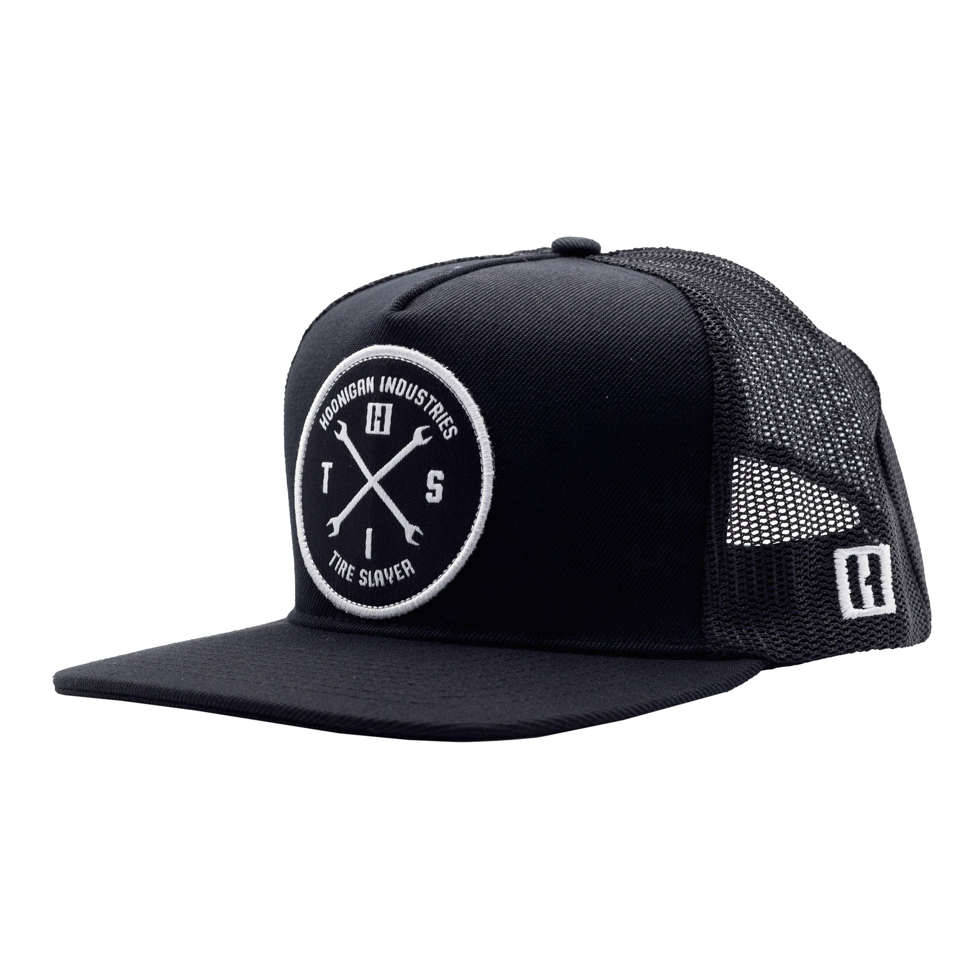 Black trucker hat with a circular embroidered patch featuring crossed wrenches, "Hoonigan Industries," and "Tire Slayer" text.