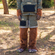 Rain-activated cargo shorts with multiple pockets, worn by a person in a furry costume, outdoors in a wooded area.